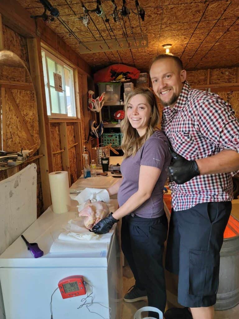 2 people culling and processing meat chickens.