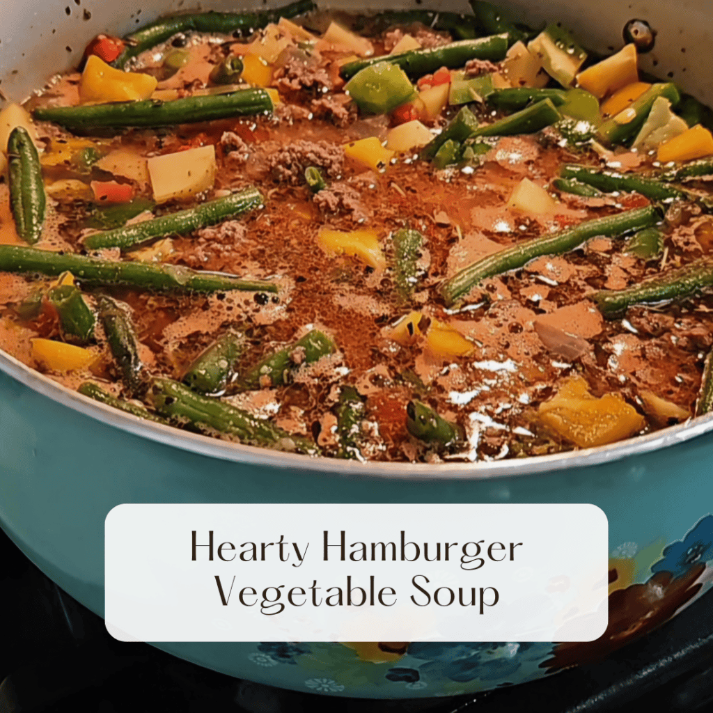 pot of hamburger soup with potatoes, carrots, green beans seasonings and more
