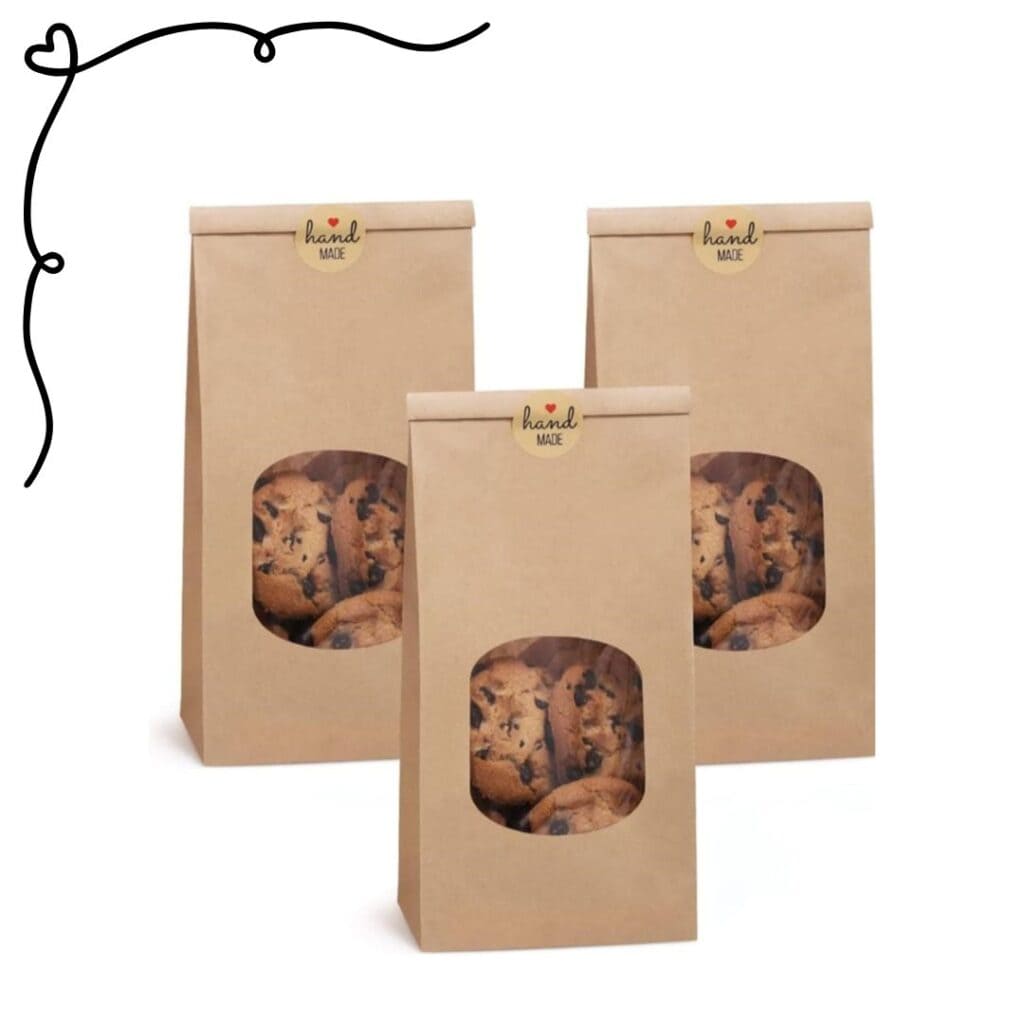 kraft cookie bags with hand made with love sticker and chocolate chip cookies 